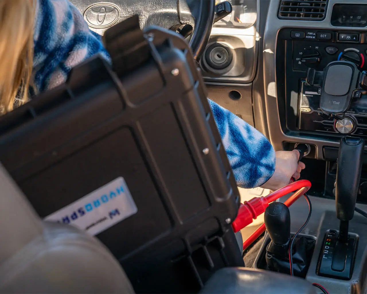 HydroSpray inside a vehicle showing it being powered through the vehicles plug